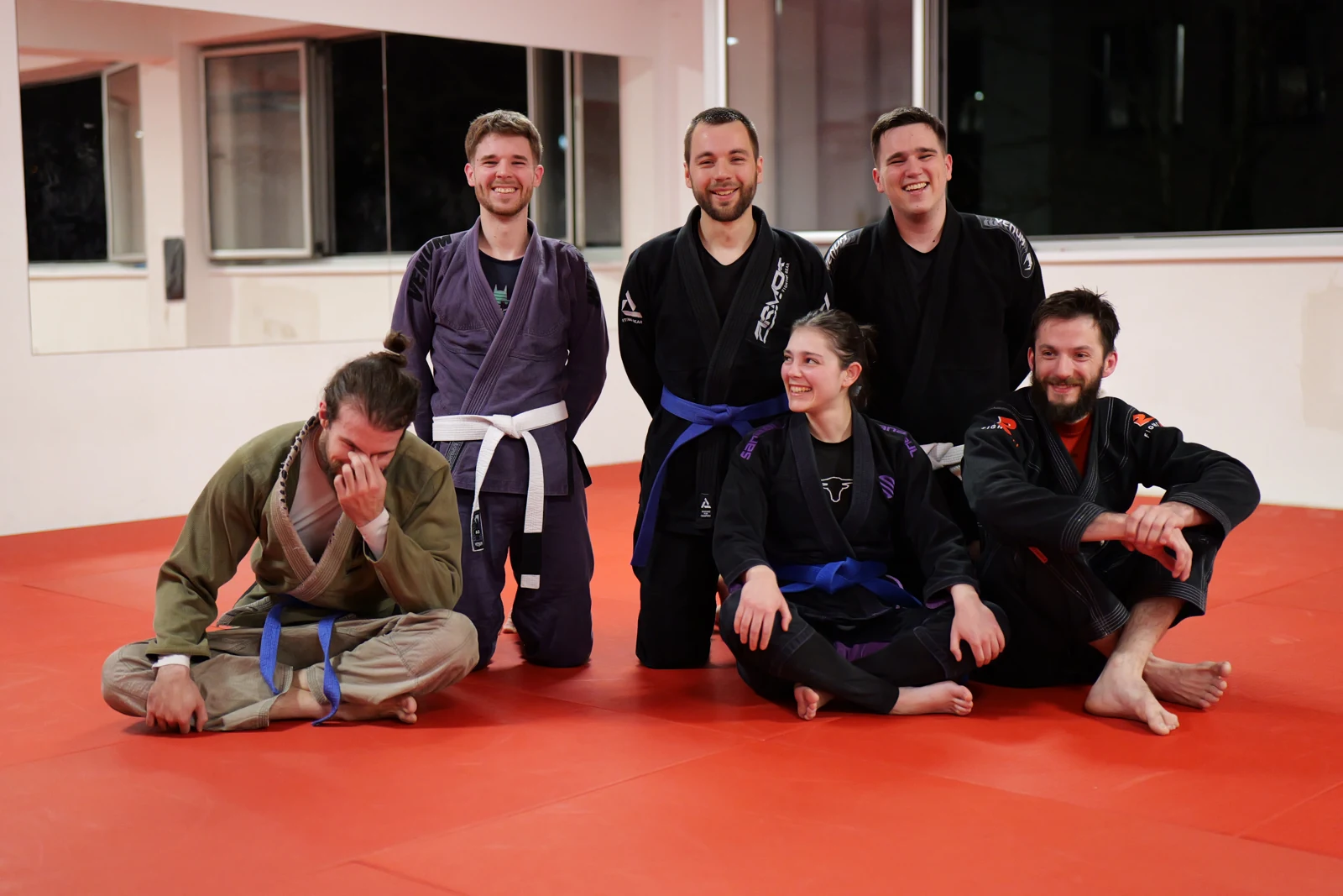A group of club members laughing while posing for a photograph